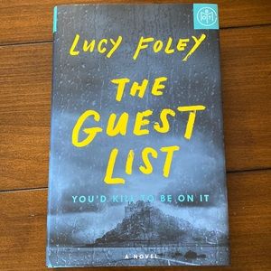 Hard cover book the guest list by Lucy Foley. Book of the month